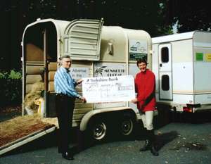 Peter Ruberry presents Sally with a cheque for 50